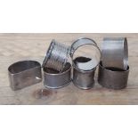 Seven assorted hallmarked silver napkin rings, wt. 5.8ozt.