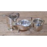 Three pieces of hallmarked silver comprising two jugs and a sauce boat, wt. 8.8ozt.