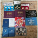 A collection of coin sets to include 4 x decimal coin sets, Jersey 1966 crowns, Isle of man 1971,