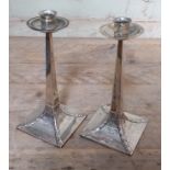 A pair of Arts & Crafts silver candlesticks, attributed design after Jan Eisenloeffel, hallmarked