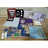 A collection of assorted coin/stamp & coin sets to include diamond wedding anniversary, her
