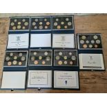 A collection of 7 uk proof coin sets 1984 -1990.