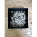 A small box of silver threepences, dated pre 1920, approx. 330g.