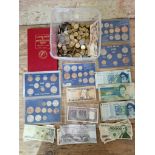 A collection of world coins and banknotes including pre decimal sets