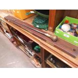 An antique mahogany and brass spirit level and stick.