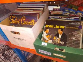 Two boxes of vinyl records, mostly country.