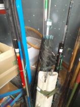 A quantity of coarse and sea fishing tackle incl: a camp bed & 2x graphite rods
