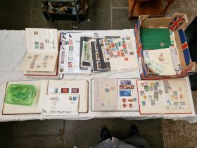 A box of stamp albums, magazines, sheets and loose stamps