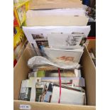 A box containing UK and world stamps, first day covers, postcards and some photos.