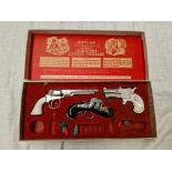 The Outlaw Presentation Case of Miniature Antique Firearms toy gun set.