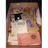 A box of UK and world stamps.