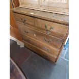 An Edwardian oak chest of drawers.