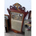 A reproduction Geoege III style mirror.