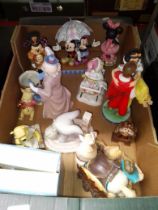 A box of mostly Disney Showcase figurines including 'Live Your Dream', 'Happily Ever After' and