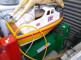 A children's ride in the form of a pay as you go motor boat - 20 p a ride - in working order
