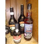 2 bottles of Baileys, 1 bottle of Dark Rum, and a small bottle of Ruby Port