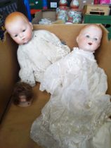 Three Armand Marseille bisque headed dolls, numbers 370, 350 & 341, various clothes.