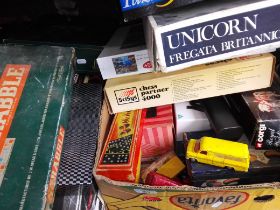A box of toys etc to include electronic chess, ship construction kit, jigsaw, playworn toy cars,