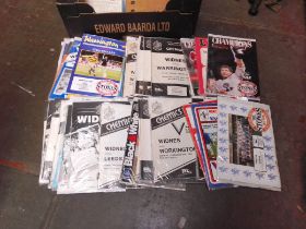 A box of assorted rugby programs
