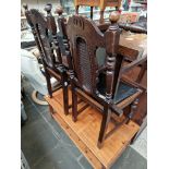 Three oak chairs and a pine coffee table.