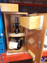 A cased Olympus microscope, model No 4743, together with a case of slides.