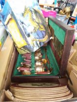 A box of misc items including canteen of cutlery, table mats, Dragon Tales figure