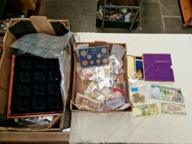 A box of GB & world coins and banknotes with a box of accessories.