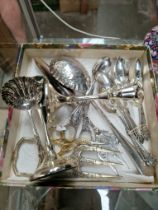 A box of assorted silver plated ware.