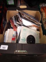 A box of 7" vinyl singles.