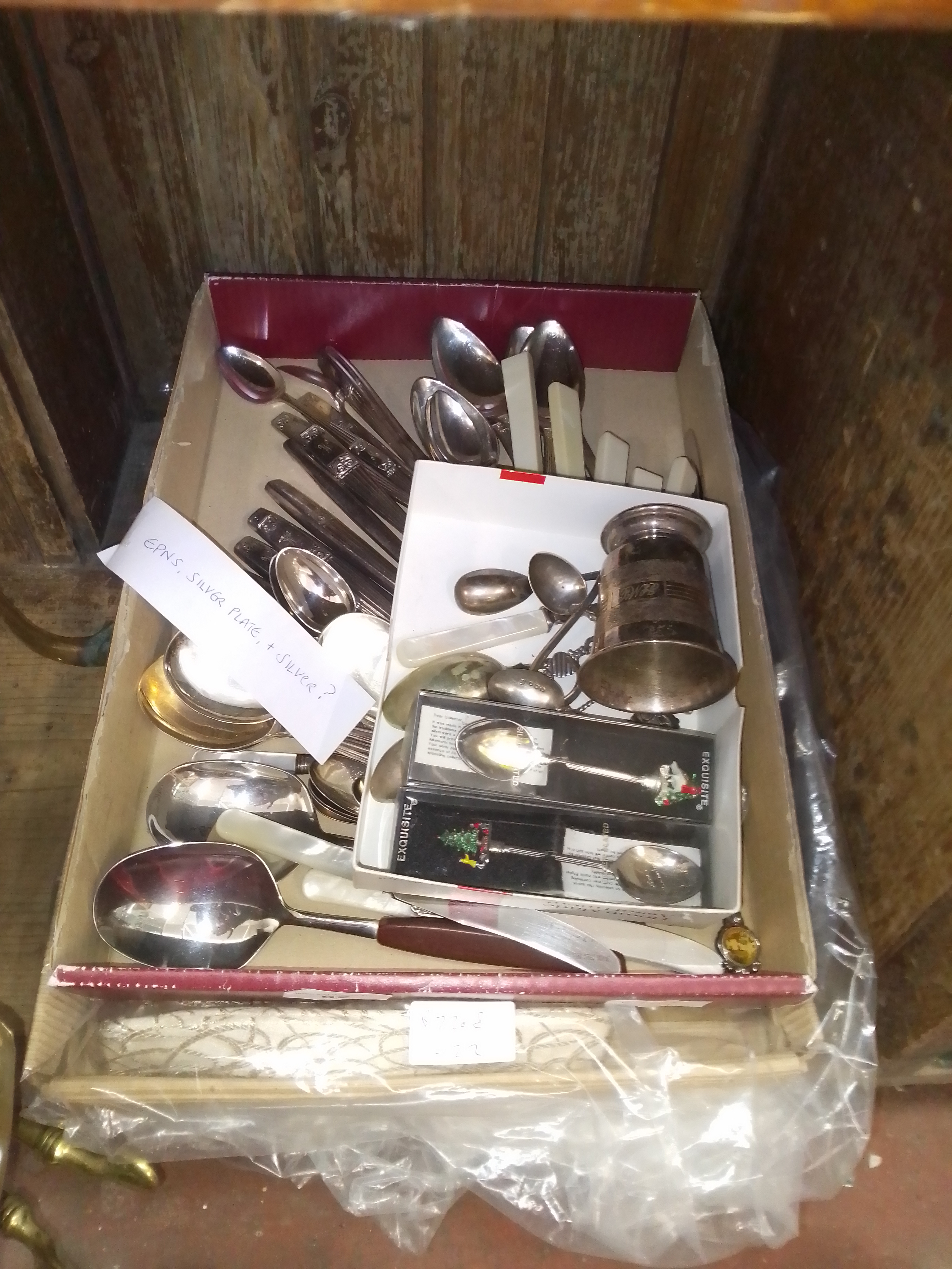 A tray of assorted mainly silver plated and two hallmarked silver apostle spoons, together with a