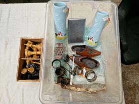 A box of assorted items including a chess set, silver napkin ring etc.