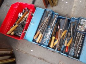 A plastic red tool box of assorted tools and a metal toolbox containing assorted tools