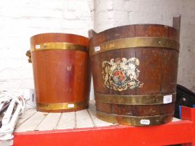 Two brass bound log buckets; one oak with crest, the other having rope and leather handle.