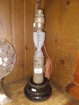 A vintage table lamp made from a mortar shell