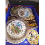 A box of assorted pottery, glass plates and a box of royal commemorative mugs.