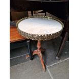 A French style marble top and gilt mounted tripod table.