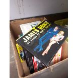 A box of books James Bond, 50 years of movie posters, railway books, Titanic, Linford Christie