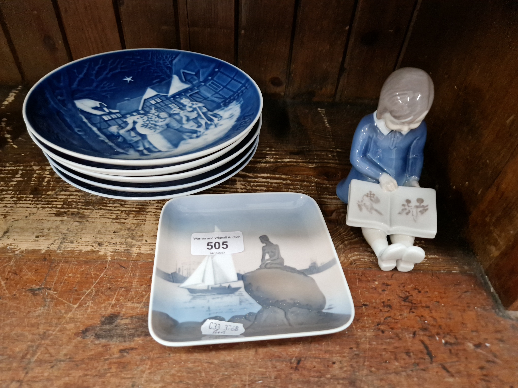 Bing & Grondahl (Denmark) - ‘First Book’ figurine with 5 Christmas plates 1987-91 and a square dish