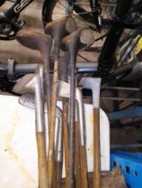 A bag of vintage golf clubs, steel and hickory shafted