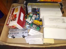 A box of toy cars, some in original boxes