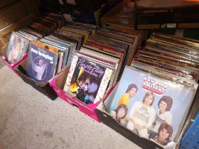 Four boxes of vinyl LP records, various genres including Bay City Rollers signed by all band