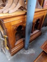 A beech and pine altar table with Gothic arches to the front.