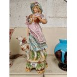 Antique continental porcelain figurine of a lady with a dog, 18inch tall