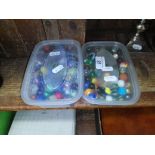 Two tubs of marbles