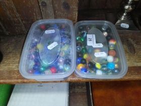 Two tubs of marbles