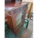 An Edwardian mahogany music cabinet.