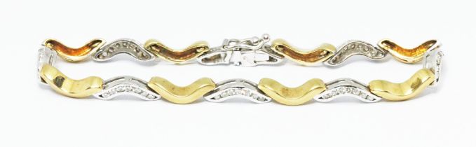An 18ct gold yellow and white gold diamond bracelet, marked '750' other indistinct marks, gross