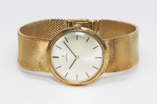 A 9ct gold Omega wristwatch, circa 1960s, case diam. 32mm, with 9ct smooth link bracelet strap,