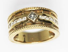 A diamond wedding ring, the bezel set princess cut central stone weighing approx. 0.20cts, ten