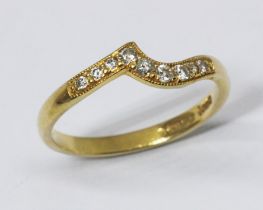 A diamond wishbone ring, nine millegrain set diamonds, hallmarked 18ct yellow gold, gross wt. 2g,